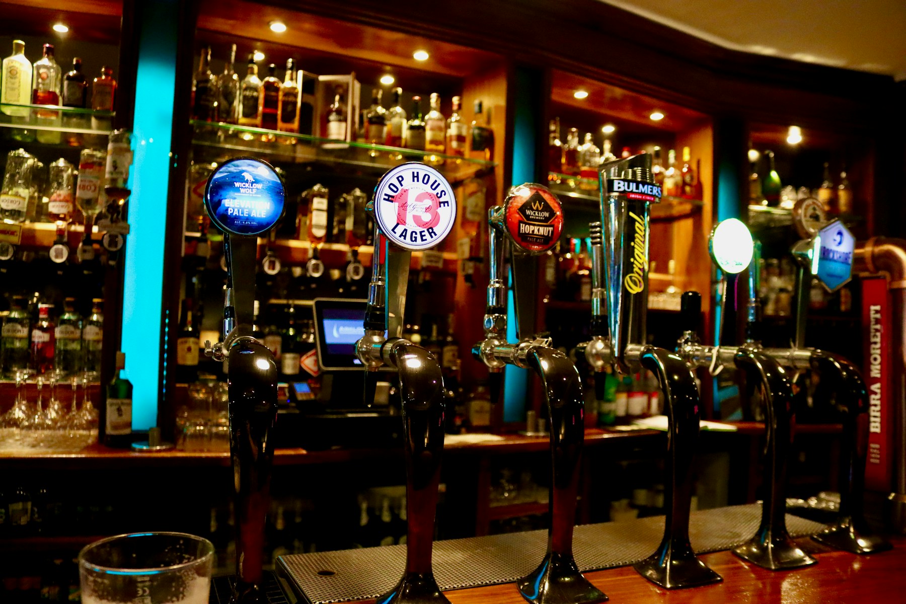 Row of beer taps at a bar