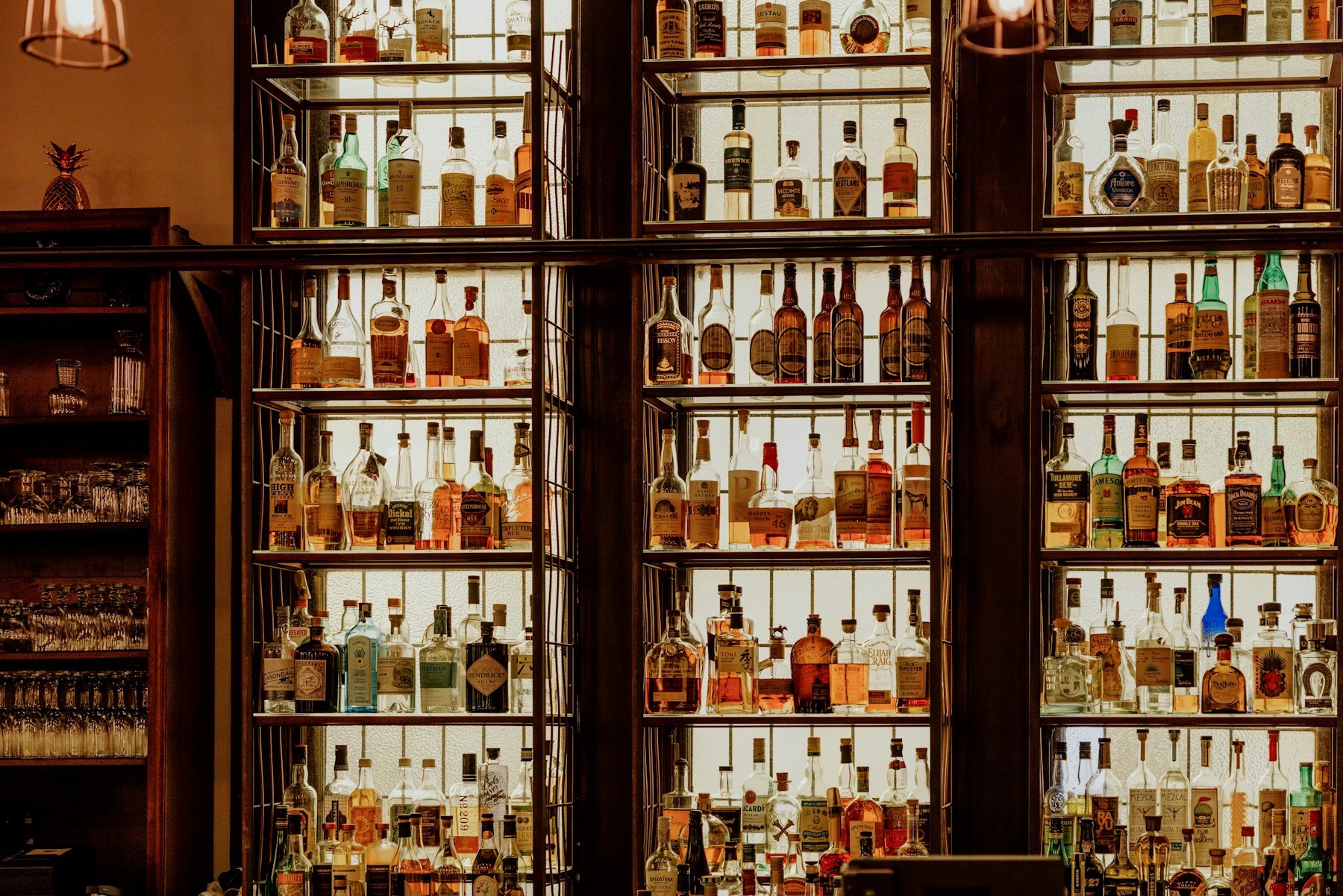 Backlit bottle display in a bar